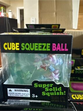 Translucent Green Cube Squeeze Ball with Colorful Stars